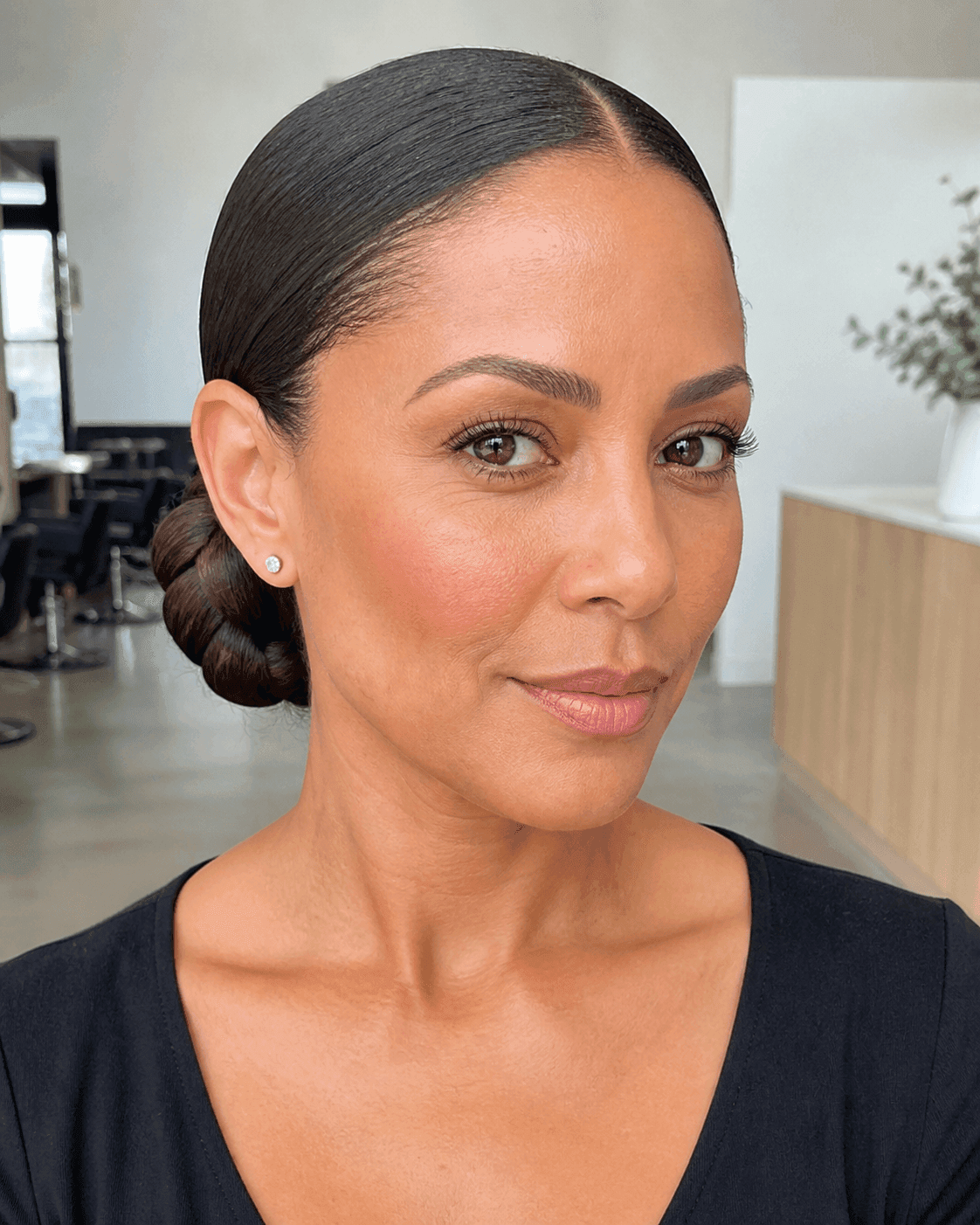 Sleek Twisted Low Bun hairstyle