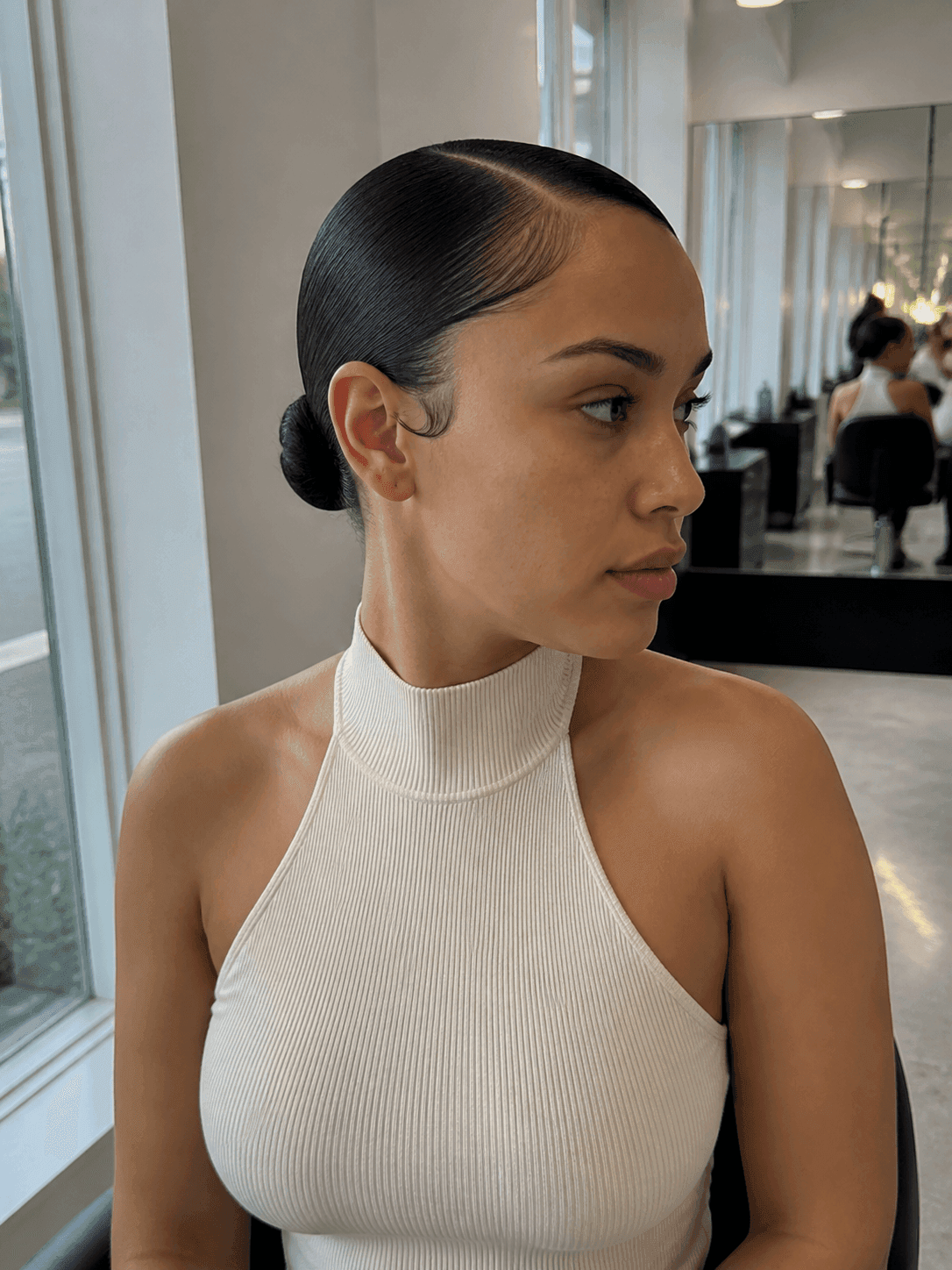 Slicked Back Bun with Edge Control hairstyle