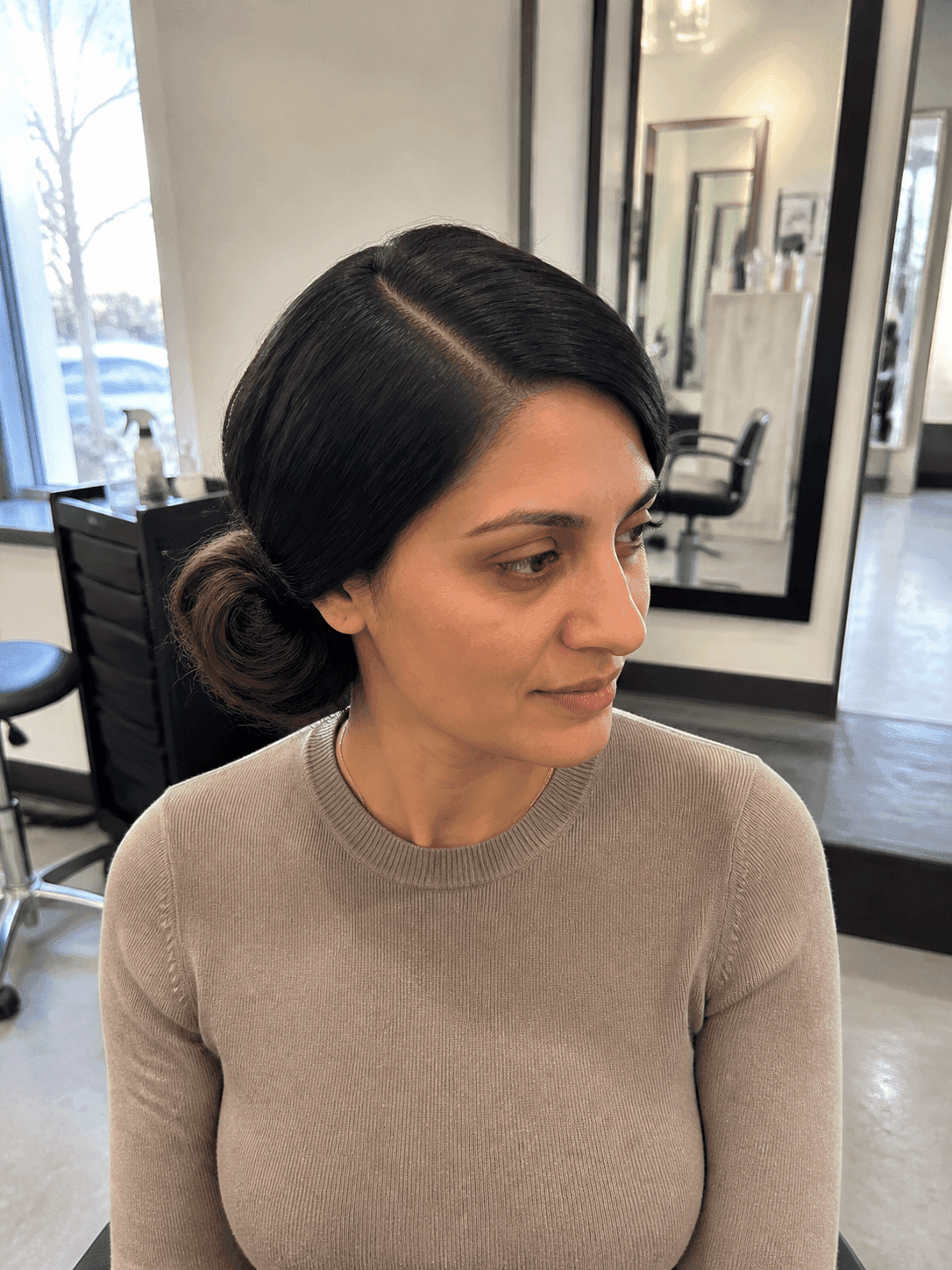 Low Side Bun with Deep Part hairstyle