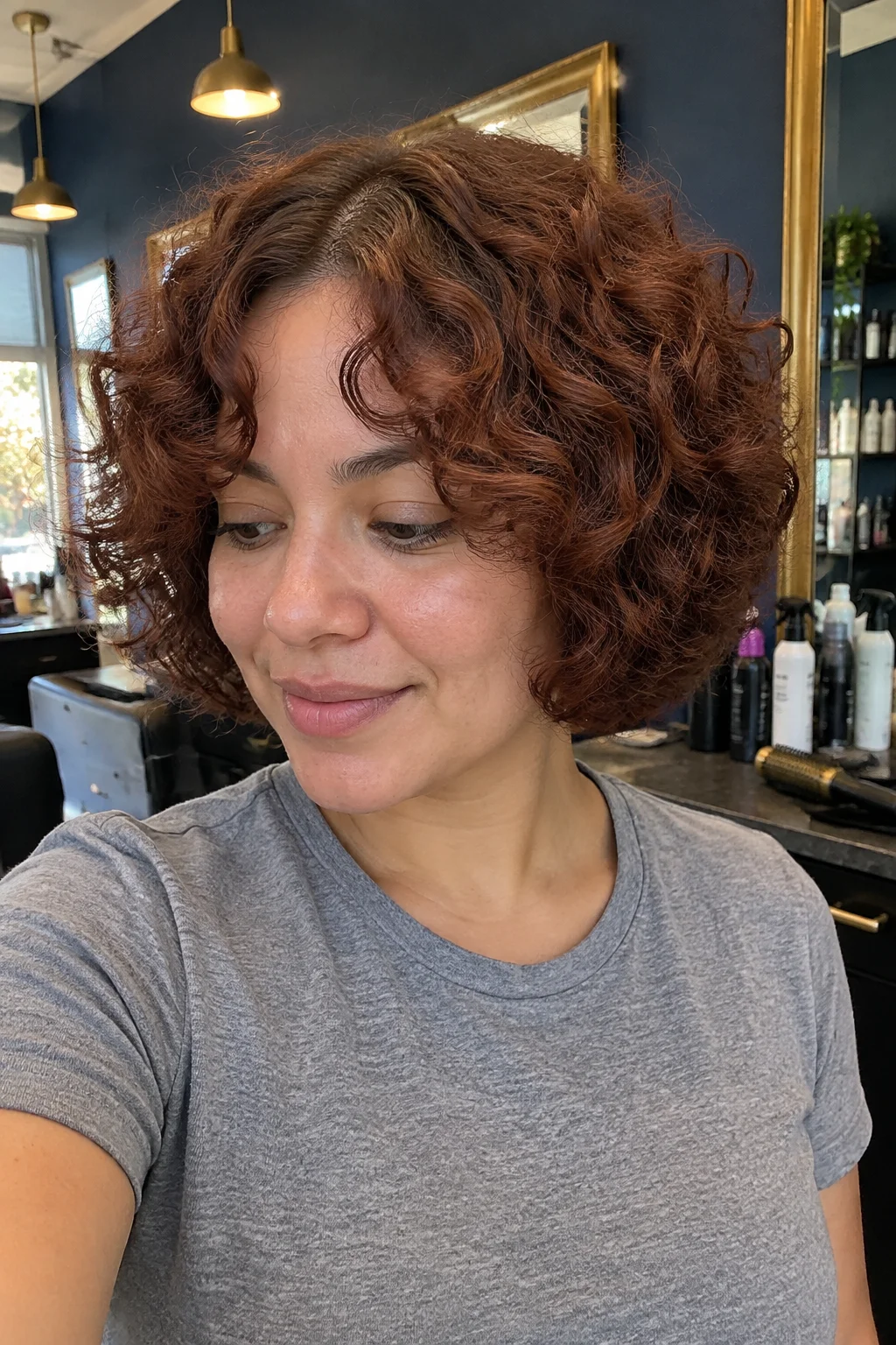 Thick Curly Layered Bob with Curtain Bangs hairstyle